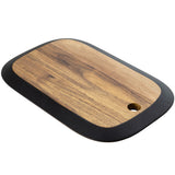 A rectangular serving board from the TableCraft Acacia Collection, featuring a dark border and small round hole for hanging. The acacia wood grain is visible on this angled board with rounded corners, set against a white background.