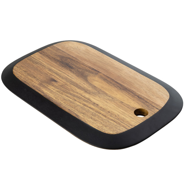A rectangular serving board from the TableCraft Acacia Collection, featuring a dark border and small round hole for hanging. The acacia wood grain is visible on this angled board with rounded corners, set against a white background.