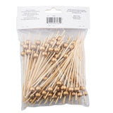 A clear plastic bag contains many TableCraft 12583 bamboo ball picks, each topped with a shiny gold bead. The back label shows product information and a barcode. The picks are arranged so the decorative gold beads are visible through the packaging.