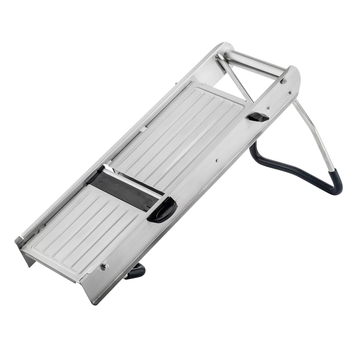 A stainless steel mandoline from the TableCraft Mandoline Slicer Set is shown at an angle, resting on its foldable black-and-silver stand. The slicer features a flat, ridged surface with an exposed blade in the center for slicing vegetables.
