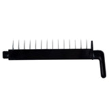 A black plastic handle with ten evenly spaced, sharp, vertical stainless steel prongs sticking out from its long side; the handle forms a right angle for easy gripping. The object is isolated on a white background. Ideal as part of a Mandoline Slicer Set.