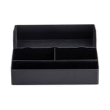 A black plastic TableCraft desk organizer with multiple rectangular compartments and built-in cup holders. The front row has two equal sections, while the back row is one long section—perfect as a Coffee Condiment Organizer on any plain white surface.