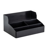 The TableCraft Coffee Condiment Organizer is a black plastic organizer with three open compartments—one wide at the back and two smaller up front. Its straight edges and raised back panel make it ideal for sorting office supplies or as cup holders in your kitchen.