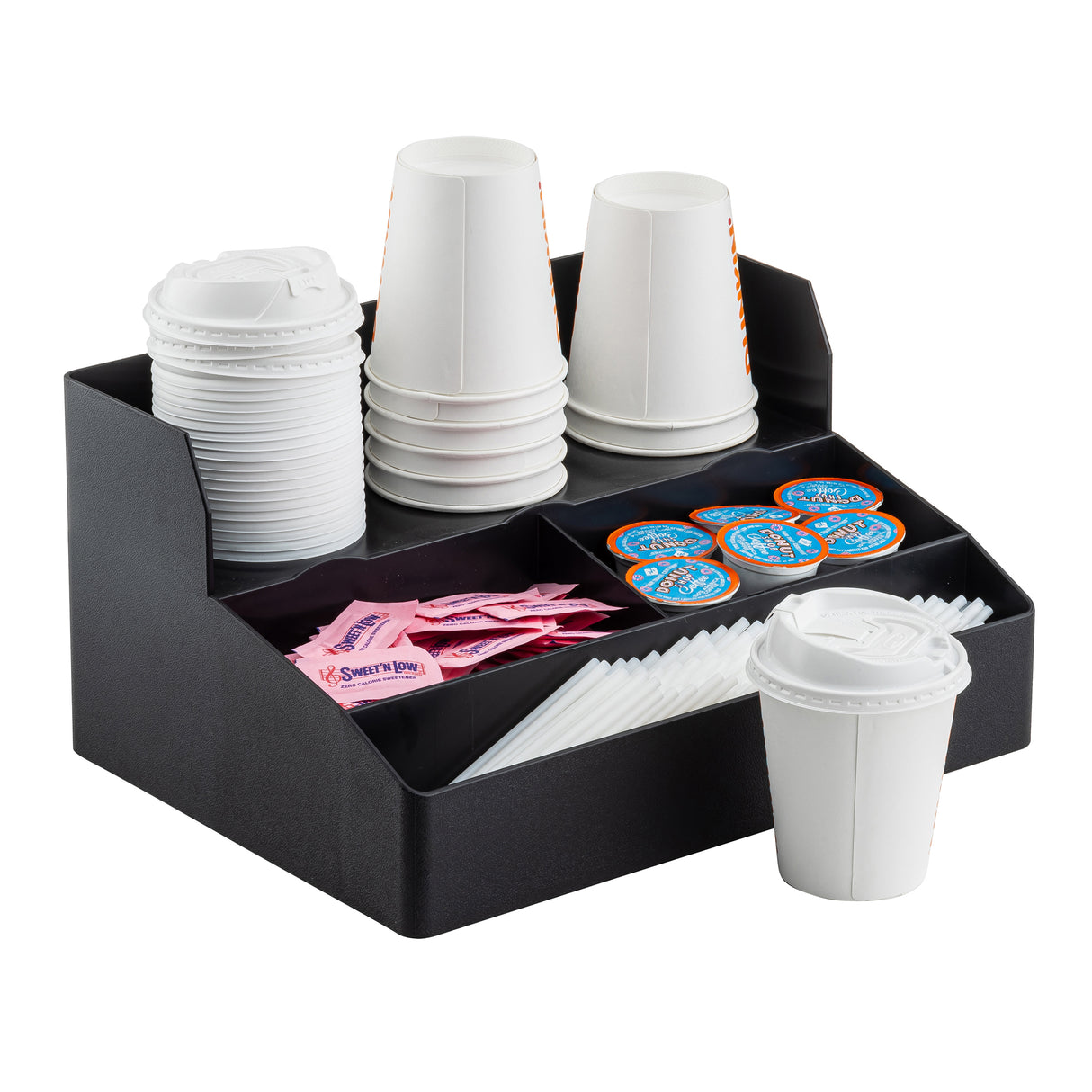 A black Coffee Condiment Organizer by TableCraft holds stacks of white paper cups, lids, cup holders, Sweet’n Low packets, creamers, and stir sticks. One lidded cup sits in front of the organizer, ready for use.