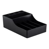 A black, rectangular TableCraft polypropylene desk and coffee condiment organizer with multiple compartments in various sizes. Its stepped design features taller sections at the back and shorter, divided spaces in front for efficient storage.