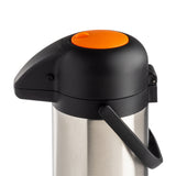 A vacuum insulated stainless steel airpot with a black lid and handle, featuring a large round orange button on top for dispensing. The modern, cylindrical design offers a sturdy, practical appearance against a white background.