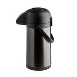 A stainless steel airpot with a black plastic lid, spout, handle, and base. This modern, cylindrical airpot is vacuum insulated to keep beverages hot or cold, and dispenses coffee by pressing down on the top. Handle is positioned upright for easy carrying.