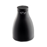A matte black, modern coffee carafe with a rounded body, small spout, and flat, circular lid. This vacuum insulated jug features a minimalist design with no visible handle and sits on a plain white background.