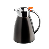 A sleek, modern black coffee carafe with a shiny stainless steel chrome lid and spout, featuring an orange push button. The carafe has a curved handle and wide base, perfect for serving beverages on any TableCraft setting.
