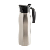 A stainless steel TableCraft thermal carafe with a sleek, curved body, black plastic lid, and large handle. Perfect for serving coffee creamer, it stands upright on a white background with a brushed metal finish.
