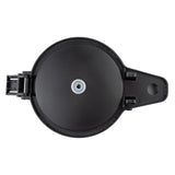 A black, round, plastic decaf lid container with a hinged lid is shown from above. The lid features a small silver-colored circular center and an orange push insert, with the hinge and latch visible on the left side.