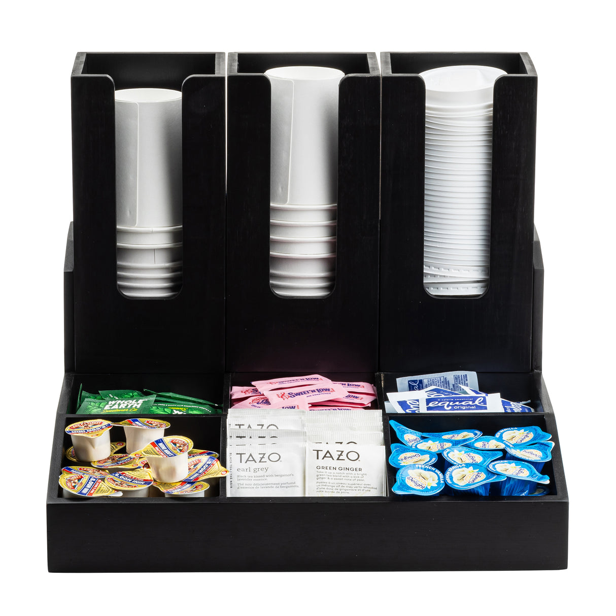 A Coffee Condiment Organizer with cup/lid holders, this black organizer neatly arranges white paper cups, tea bags, sugar packets, creamer cups, and sweeteners into separate compartments for easy access.