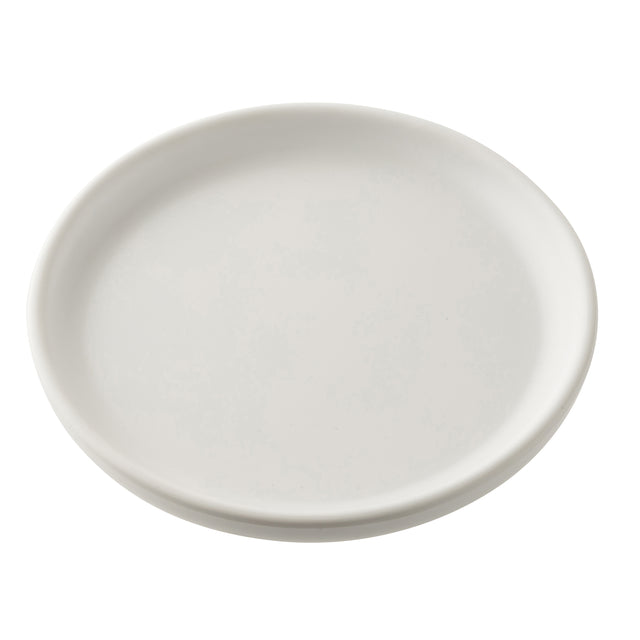 A plain, round, white serving plate from the Terra Collection is shown against a white background. The melamine surface has slightly raised edges and no decorations, with lighting that highlights its simple and clean design.