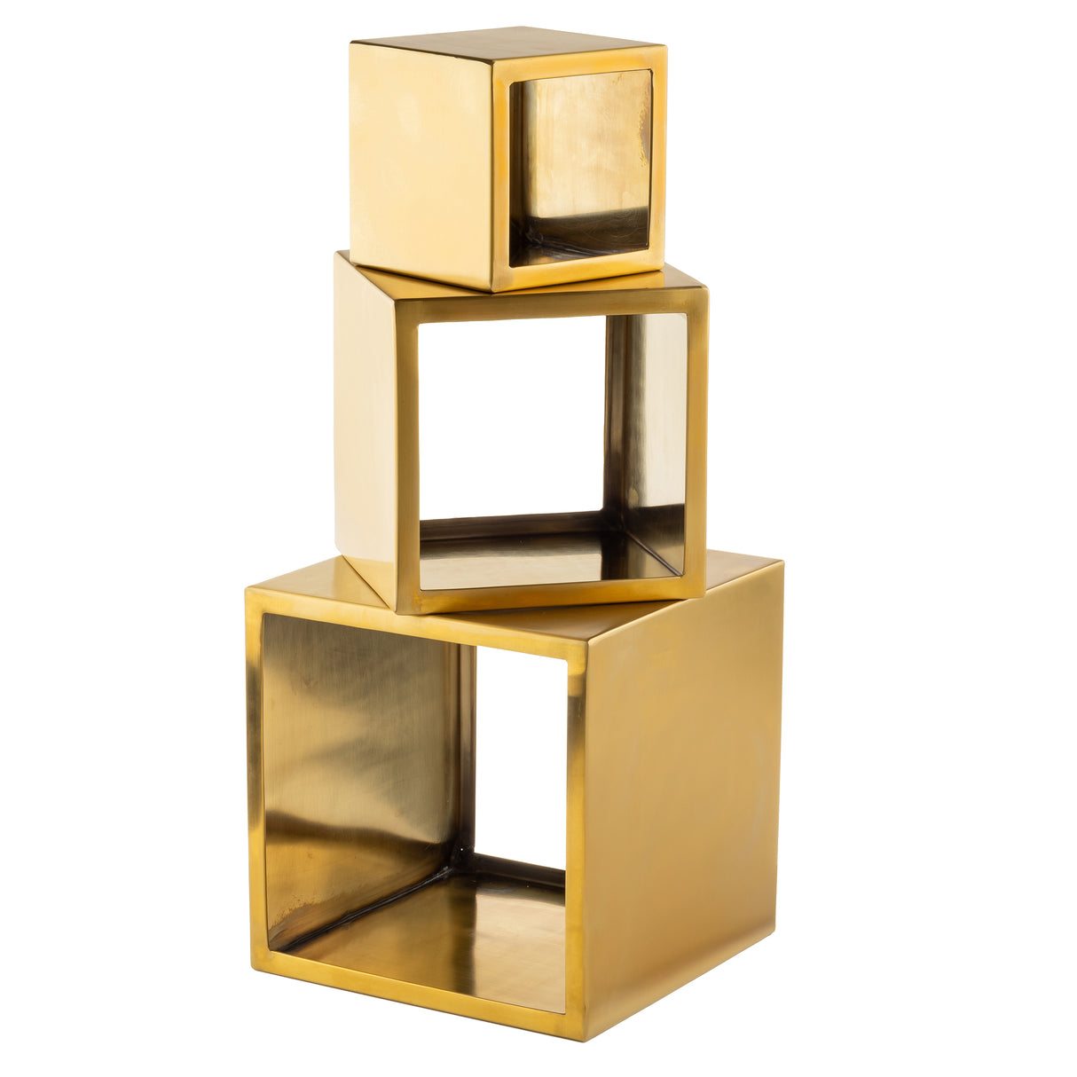 Three metallic gold cubes, resembling a gold riser set, are stacked unevenly. The top cube is solid, while the two below are hollow with open faces. Each is angled differently, forming a modern geometric sculpture.