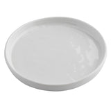 A plain, round white Ridge Collection Serving Plate with slightly raised edges is shown on a white background. The smooth, glossy surface features subtle reflections, highlighting its shiny finish and simple, unadorned TableCraft Products design.