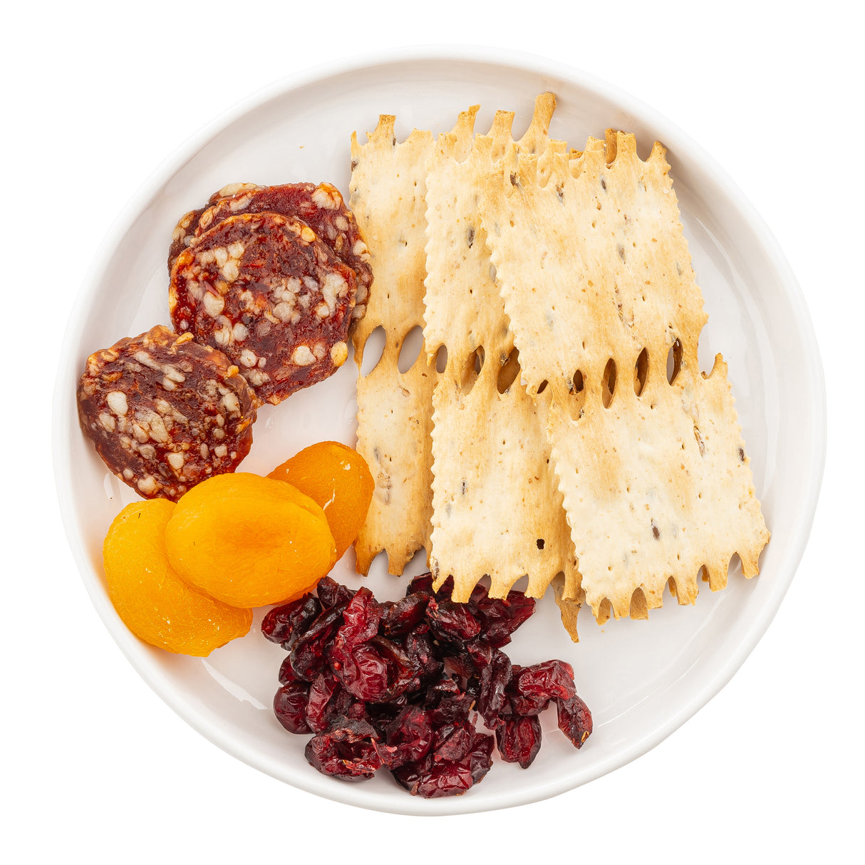 A Ridge Collection Serving Plate by TableCraft Products displays three slices of salami, dried apricots, cranberries, and six ridged crackers arranged neatly on a white melamine serving plate.