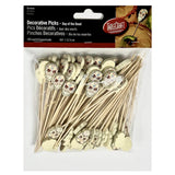 A package of TableCraft Bamboo Picks featuring Day of the Dead sugar skull designs. The clear bag holds 100 decorative picks, each topped with a vibrant paper skull. The label includes English, French, and Spanish text.