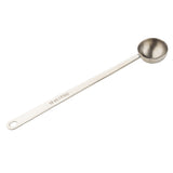 This stainless steel coffee scoop features a long handle and a round bowl, stamped with 10 ml / 2 tsp. Its simple, utilitarian design includes a handy hanging hole for easy storage.
