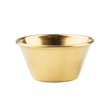 A small, shiny, gold-colored stainless steel ramekin with a wide rim and tapering base, featuring a smooth gold PVD finish. This 2 oz. bowl has a polished surface and a simple, minimalist design against a plain white background.