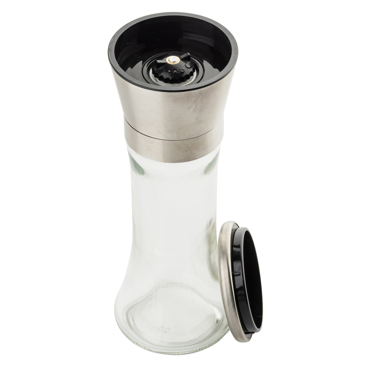 A clear glass pepper grinder from TableCraft Products, part of a stylish Salt & Pepper Mill Set, features a stainless steel top and black grinding mechanism. The empty grinder is displayed with its screw-on lid beside it on a white background.