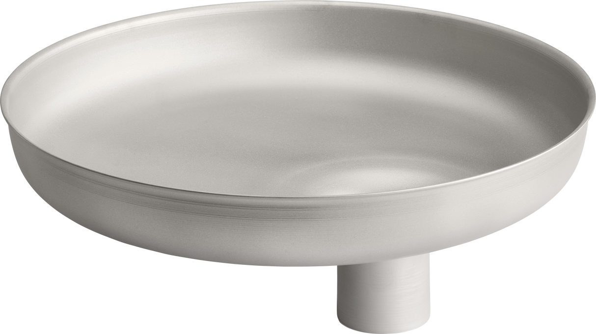 A minimalist, round stainless steel grind pan with smooth sides and a flat base, elevated by a short cylindrical pedestal at the center bottom. The matte silver surface features subtle circular ridges—perfect for Hobart applications with modern design.