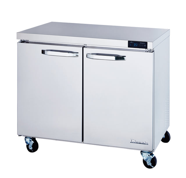 A stainless steel undercounter refrigerator with two doors, each featuring a horizontal handle. The ENERGY STAR unit sits on four black caster wheels, with a digital temperature display above the doors. The surface is clean and reflective.