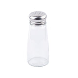 A clear glass Salt/Pepper Shaker with a stainless steel top featuring multiple small holes. The empty shaker stands upright against a plain white background.