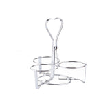 A chrome plated, silver wire metal holder by TableCraft features a heart-shaped handle on top and three circular compartments below, perfect as a syrup dispenser rack. The holder stands on a white background.