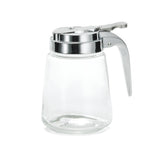This Modern Glass Dispenser holds 8 oz. and features a silver metal lid with a lever for easy pouring. Dishwasher safe, it’s empty and displayed against a plain white background.