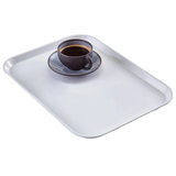 A dark ceramic cup filled with black coffee sits on a matching saucer, placed on a high-impact fiberglass tray with rounded edges, set against a plain white background.