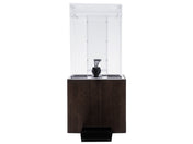 A modern water dispenser with a clear rectangular upper container, a black spigot, and a dark wood-style bamboo beverage dispenser base. A small, black drip tray sits at the bottom. The background is plain white.
