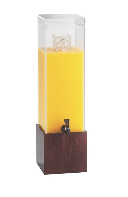 A tall, clear Westport Beverage Dispenser with a 3 gallon BPA Free capacity is filled with orange juice and ice cubes. It features a black spigot near the base, set in a dark wooden square stand against a plain white background.