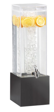 A tall, clear 3 Gallon beverage dispenser with an ice chamber in the center and lemon slices floating on top. It stands on a black square base and features a silver spigot for easy pouring. The water inside is refreshingly cold and clear.