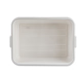 Rectangular, white plastic tote box viewed from above. It has rounded corners, horizontal grooves on the interior bottom, two small handles on the shorter sides, and a plain white background. Stackable and dishwasher safe.