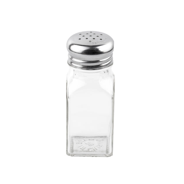 A clear glass shaker with a square shape and a stainless steel top featuring several small holes sits upright on a white background. The empty glass, part of classic salt and pepper shakers, has an embossed floral pattern near the base.