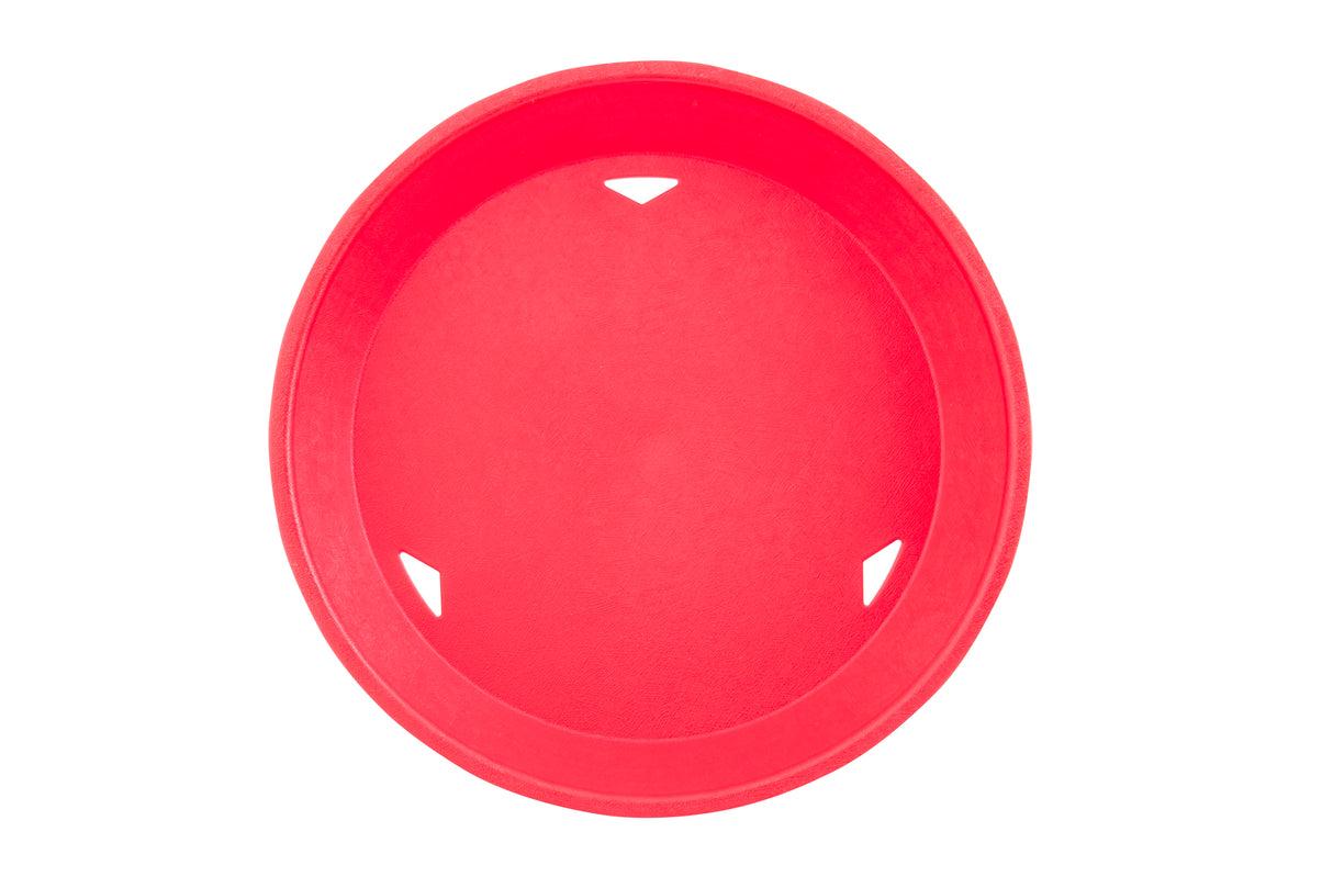 A round, bright red plastic platter basket viewed from above, with three small triangular cut-outs along the rim. The smooth, heat resistant surface sits against a plain white background.