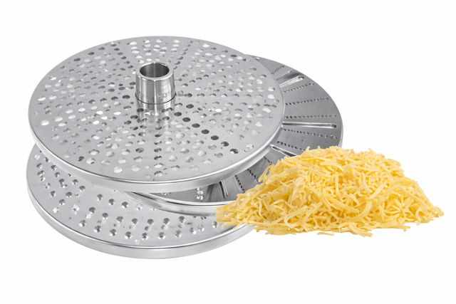 Three round, stainless steel grater discs with different hole patterns are stacked on each other. Next to them lies a small pile of shredded yellow cheese, highlighting the use of a fine grater plate. The background is plain white.