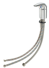 A chrome deck-mount faucet features a single handle atop a cylindrical base with blue and red temperature indicators. Two braided metal supply hoses extend downward, and the faucet includes a durable ceramic cartridge valve.