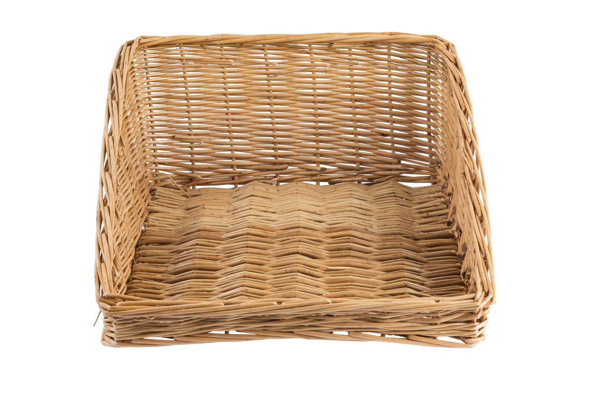 A handwoven rectangular basket tray with low sides and an open front, featuring a woven pattern. The empty willow basket sits against a white background, highlighting its natural brown color and wicker texture.