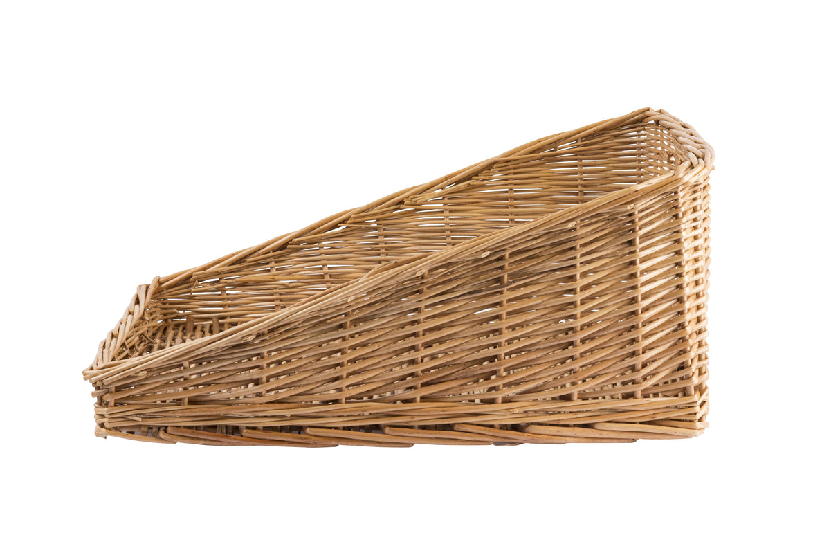 A slanted, rectangular willow basket magazine holder with open sides and a woven pattern, shown against a white background. The handwoven basket features a higher back and lower front for easy access to contents.