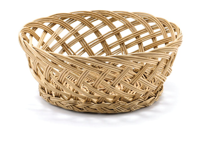 A round, empty, light-brown handwoven basket with an open weave pattern sits on a white surface. The basket features intertwined, crisscrossed strands and a slightly flared rim, creating a textured, airy appearance.