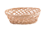 A shallow, oval-shaped handwoven basket made of light-colored, interwoven reeds sits on a white background. The basket features a crisscross pattern with an open weave design and no handles.