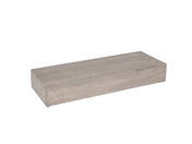 A rectangular Aspen Riser crafted from gray-washed pine wood sits on a white background. The block has smooth surfaces and sharp edges, appearing solid and unfinished with a minimalist design.