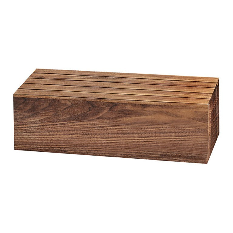 A rectangular walnut knife block with a smooth finish and visible natural wood grain. Several narrow slots are cut into the top surface, designed to hold knives securely. The block rests on a white background like a refined display crate.