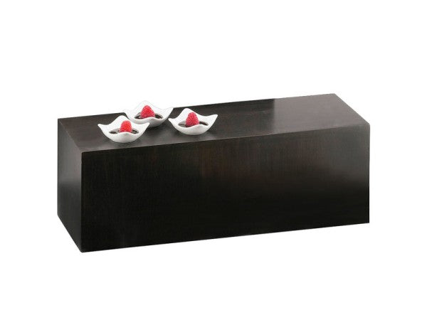 A rectangular, dark wooden coffee table with a smooth surface, styled like a bamboo crate. On top, three small, white, leaf-shaped bowls each hold a red decorative object. The background is plain white.