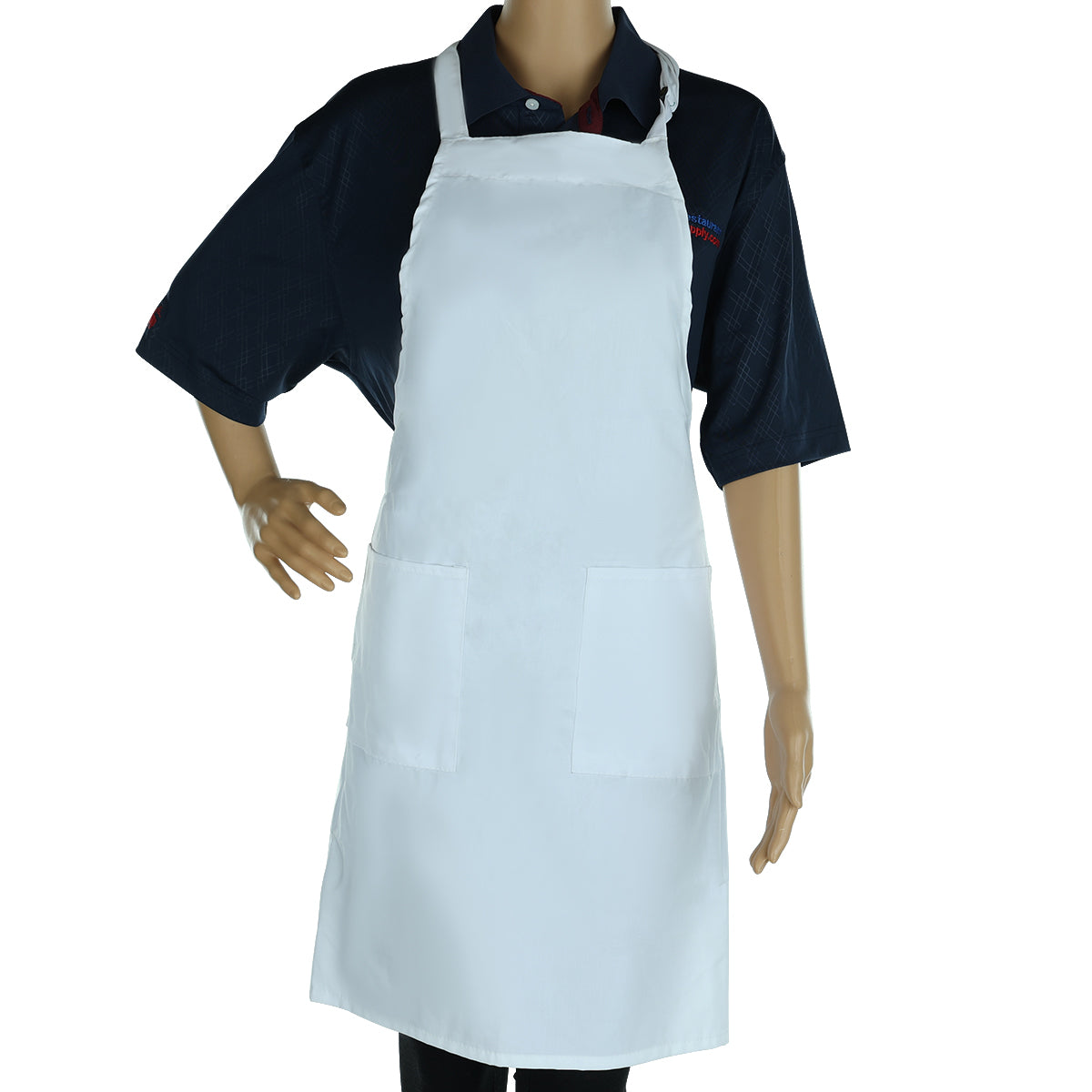 A mannequin dressed in a navy blue short-sleeve shirt is wearing a plain white poly-cotton blend bib apron with two front pockets. One hand rests on its hip while the other is by its side. The background is plain white.