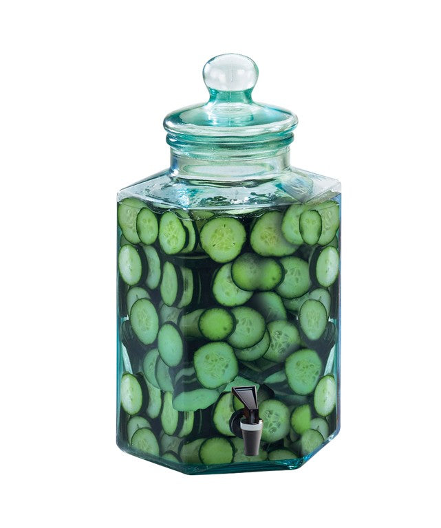 A BPA free, 2 gallon hexagonal infusion dispenser with a lid and spigot, filled with water and fresh cucumber slices, shown on a white background.