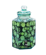 A BPA free, 2 gallon hexagonal infusion dispenser with a lid and spigot, filled with water and fresh cucumber slices, shown on a white background.