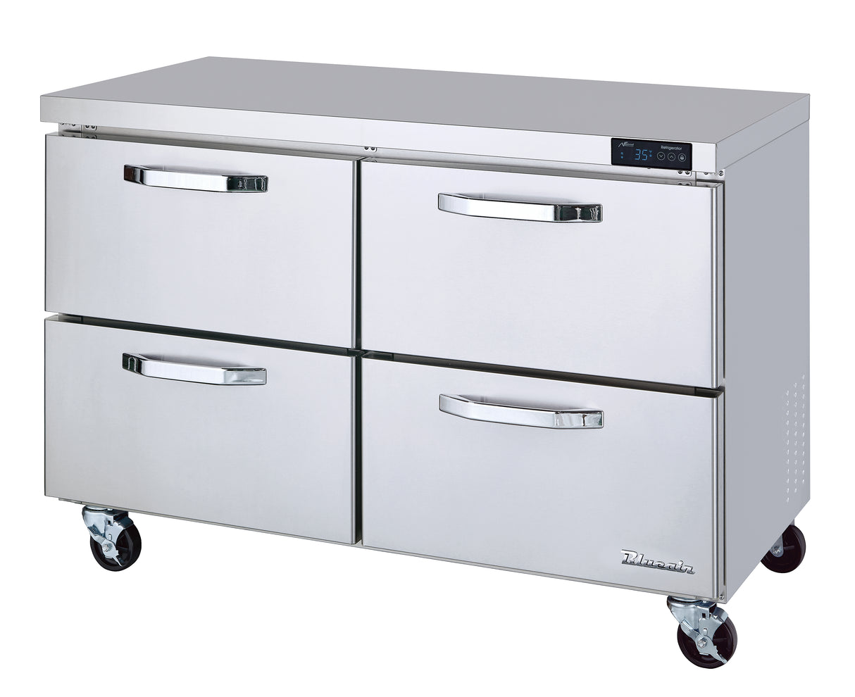 A commercial stainless steel refrigerator with four horizontal drawers, each featuring curved handles. This undercounter refrigerator has a flat top, digital temperature display, side vents, and sits on four caster wheels for mobility.