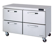 A commercial stainless steel refrigerator with four horizontal drawers, each featuring curved handles. This undercounter refrigerator has a flat top, digital temperature display, side vents, and sits on four caster wheels for mobility.